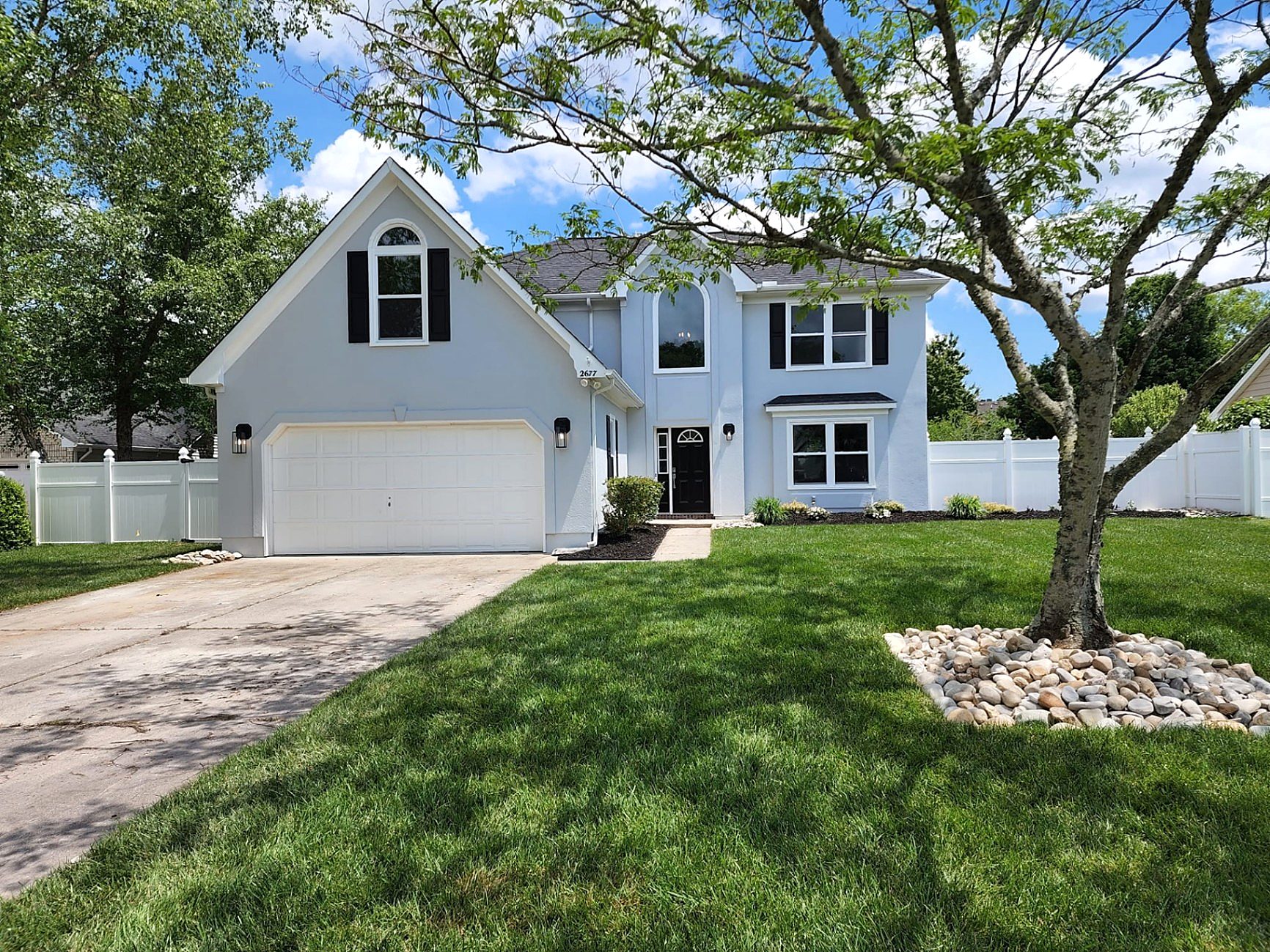 Freshly updated home exterior with modern paint, trim, and curb appeal landscaping in Hampton Roads VA